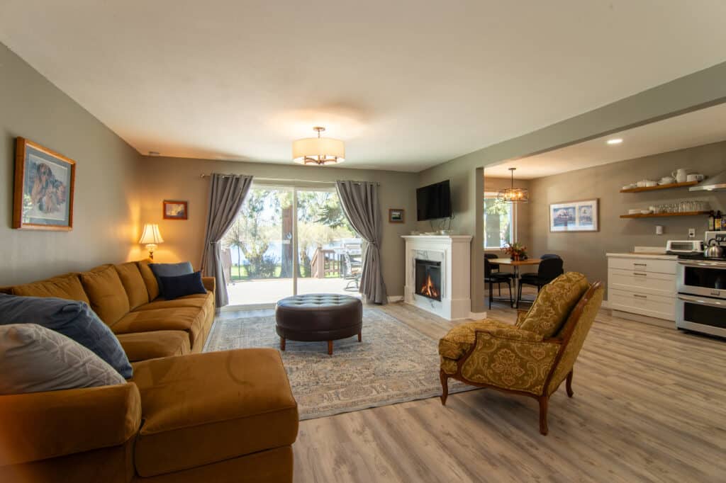 The Gold Cabin living room, dining area, and kitchen with a view of the lake.